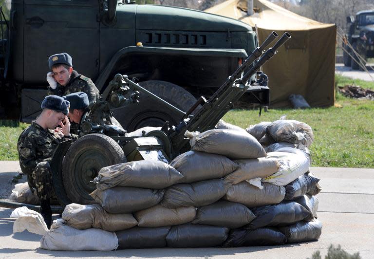 Ukrainian soldiers at checkpoint at the Belbek airbase not far from the Crimean city of Sevastopol, on March 21, 2014