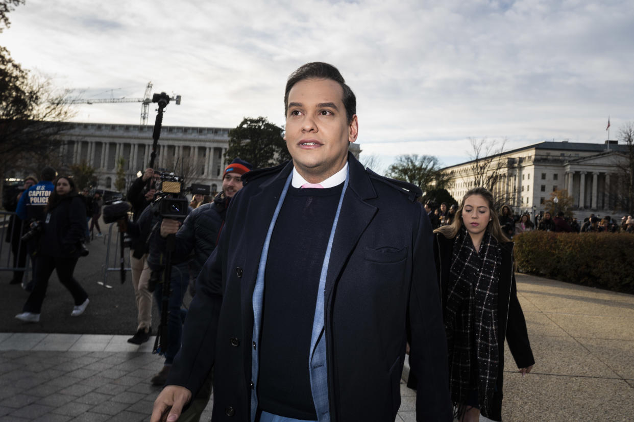 Rep. George Santos departs after speaking about the House Ethics Committee report during a press conference outside Capitol Hill in November 2023 in Washington, D.C.