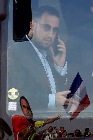 FILE PHOTO: Soccer Football - World Cup - The France team return from the World Cup in Russia - Charles de Gaulle Airport, Roissy, France - July 16, 2018. Alexandre Benalla, French presidential aide for security, rides on the team bus. REUTERS/Pascal Rossignol