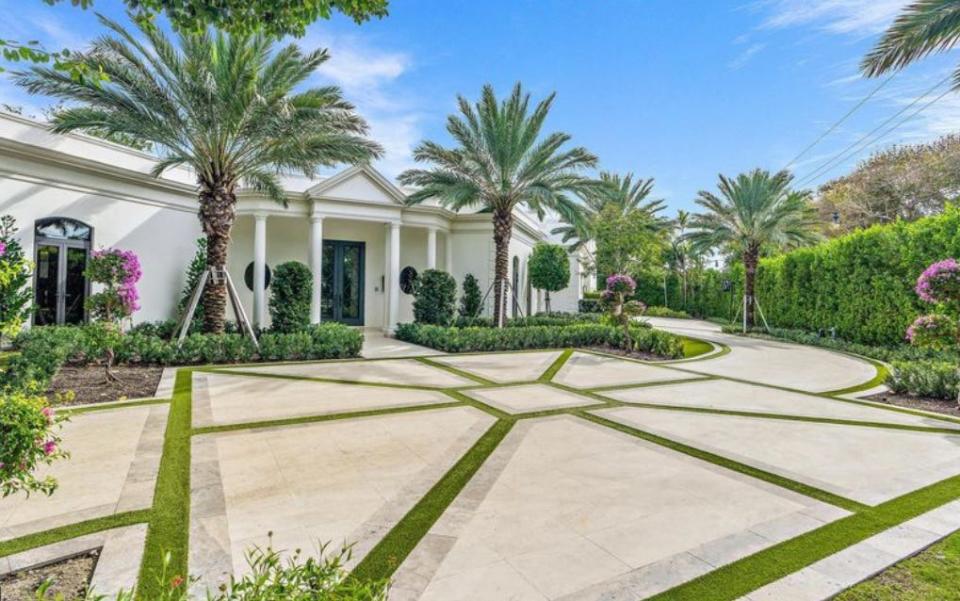 Just listed at $35 million, a renovated Palm Beach house at 150 El Vedado Road has elements common to the Palm Beach Regency style, including a flat roof and a triangular pediment supported by columns on the front porch.