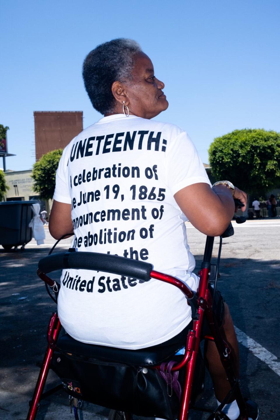 Tina Edwards, 62, from Leimert Park, shows off a T-shirt celebrating Juneteenth.