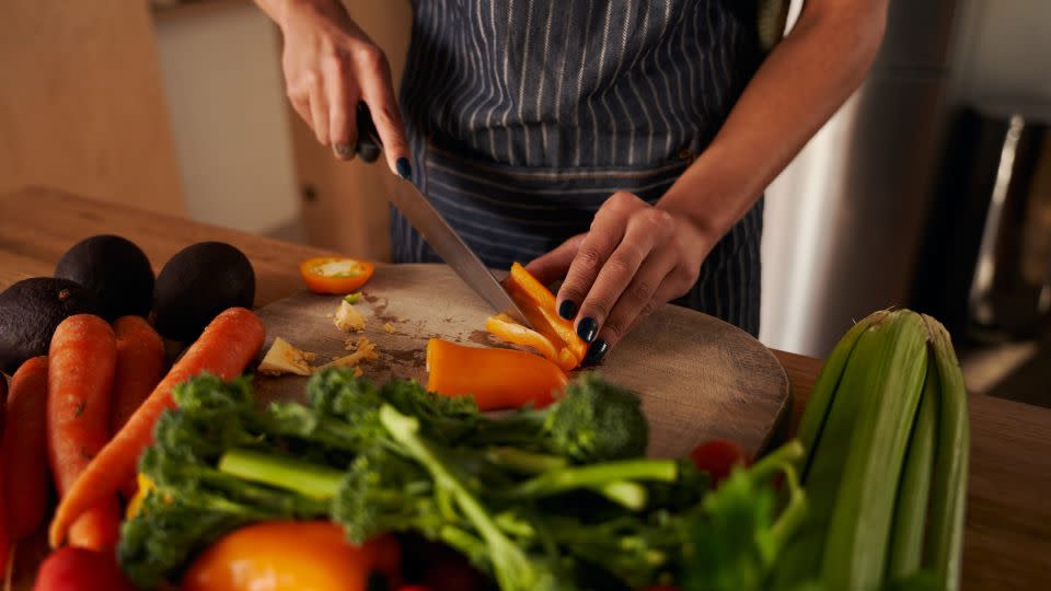 A separate cutting board for produce and cheese helps to avoid cross contamination in the kitchen. - Sarah McEwan/iStockphoto/Getty Images