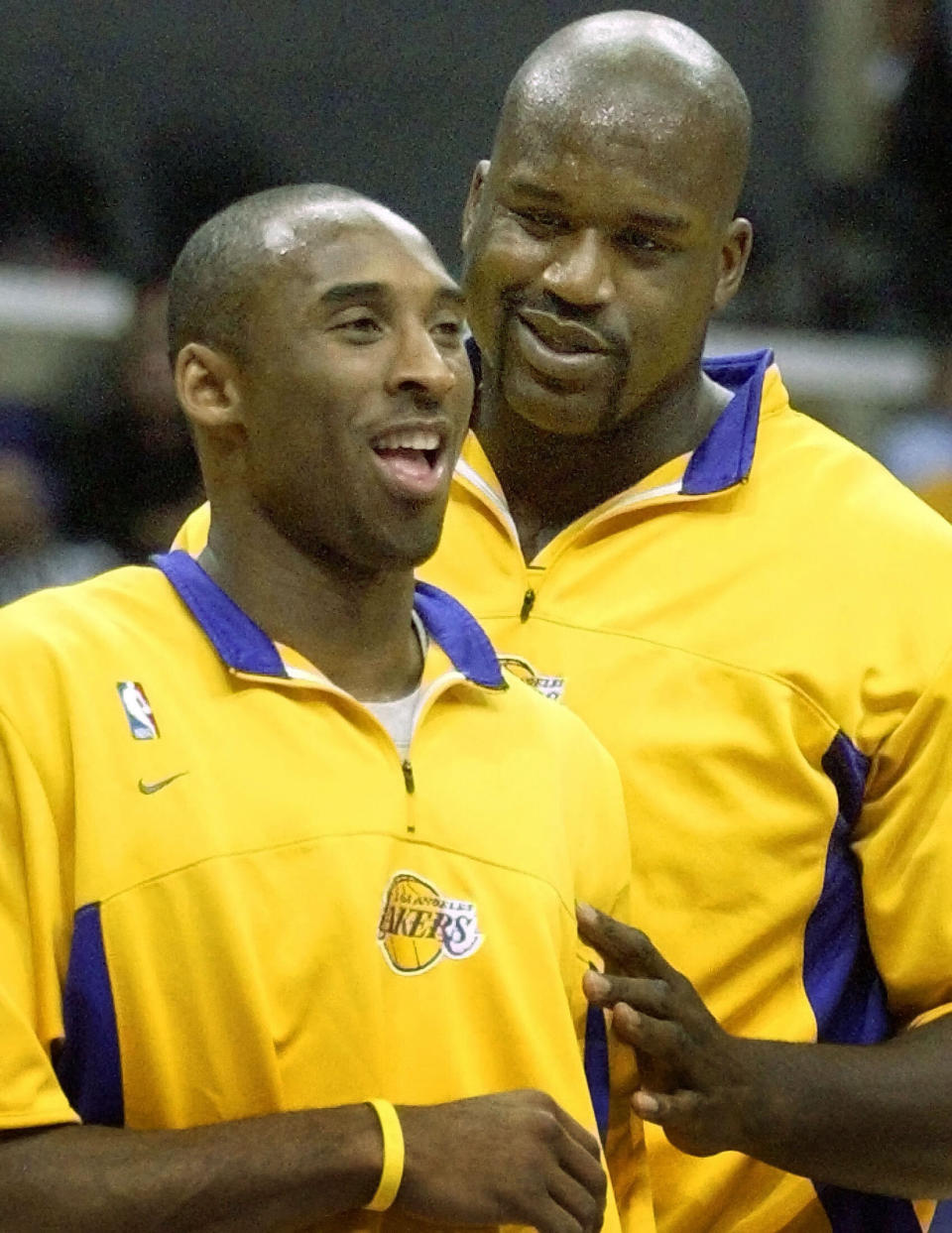 O'Neal jokes with his teammate and rival Bryant before their NBA game against the Detroit Pistons in Los Angeles on Nov. 14, 2003.  (Photo: Lucy Nicholson / Reuters)