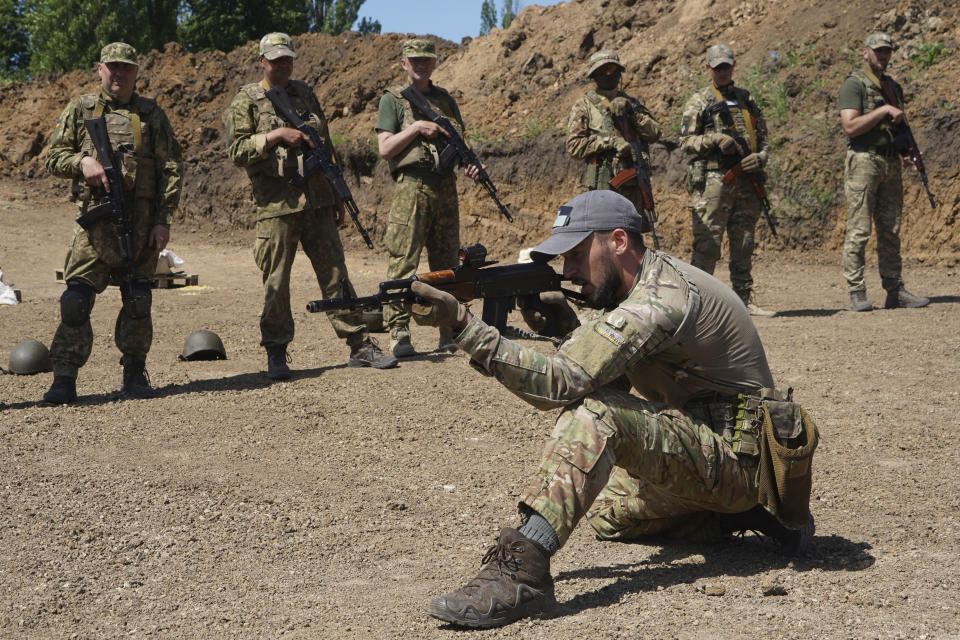 Servicemen of the newly created National Guard unit train in the Kharkiv region, Ukraine, Thursday, June 1, 2023. (AP Photo/Andrii Marienko)