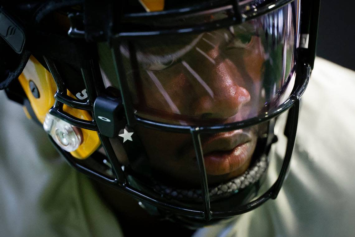 The indoor field is seen reflectedAppalachian State running back Daetrich Harringtons visor during team practice in Boone, N.C., Tuesday, Aug. 30, 2022. The Appalachian State Mountaineers football team is preparing to host UNC this weekend.
