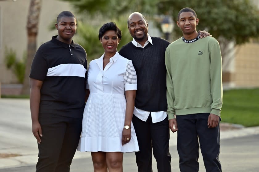 Allen Shelton, second right, and his son Christian, left, wife Wendy and son Allen Jr. pose in their suburban Las Vegas neighborhood on October 22, 2020, in Las Vegas Nevada. This was the first presidential election that the SheltonOs two sons were able to vote. (Photo by David Becker/For the Times)