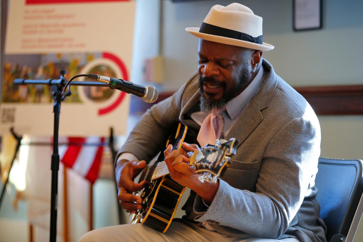 Cedric Josey performs a song he wrote titled 'Being in New Bedford' during a ceremony held at the downtown New Bedford Public Library where New Bedford Creative announced the release of eighty two grant awards totaling $509,200.
