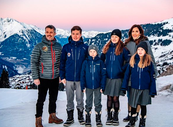 princess Mary Prince Frederik and their kids wearing coats posing on the Swiss Alps