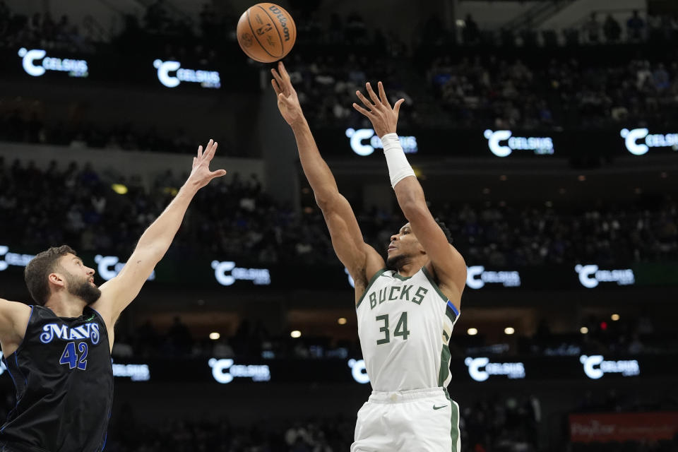 Milwaukee Bucks forward Giannis Antetokounmpo (34) shoots against Dallas Mavericks forward Maxi Kleber (42) during the first half of an NBA basketball game in Dallas, Saturday, Feb. 3, 2024. (AP Photo/LM Otero)