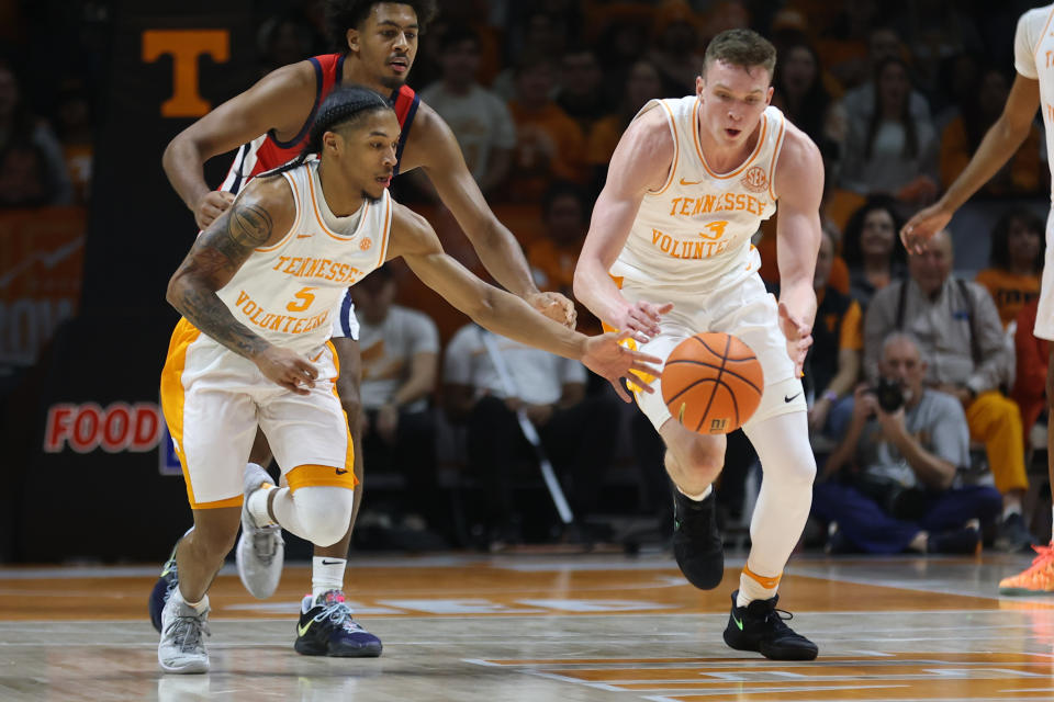 Jan 6, 2024; Knoxville, Tennessee, USA; Tennessee Volunteers guard Zakai Zeigler (5) and guard Dalton Knecht (3) scramble for a loose ball during the first half against the Mississippi Rebels at Thompson-Boling Arena at Food City Center. Mandatory Credit: Randy Sartin-USA TODAY Sports