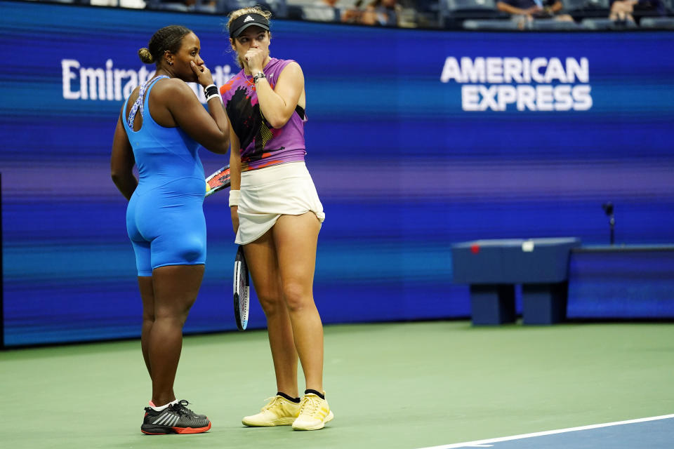 Taylor Townsend, of the United States, left, and Caty McNally, of the United States, confer while competing against Barbora Krejcikova, of the Czech Republic, and Katerina Siniakova, of the Czech Republic during the final of the women's doubles at the U.S. Open tennis championships, Sunday, Sept. 11, 2022, in New York. (AP Photo/Matt Rourke)