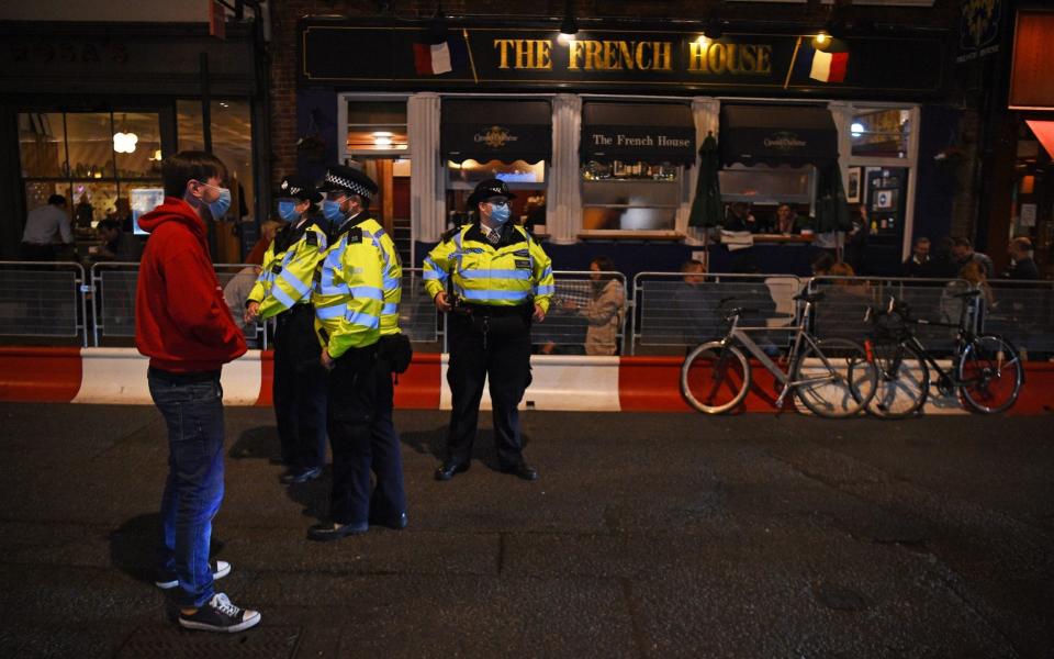 Police have the unenviable task of dispersing revellers once the curfew hits - Kirsty O'Connor/PA