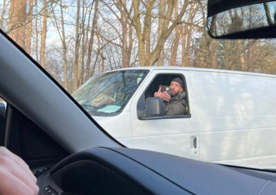 Hassan Yehia Chokr, 35, was charged by Oakland County Prosecutor Karen McDonald, accused of making anti-Semitic and racist threats against children and adults while outside Temple Beth El in Bloomfield Township. He's pictured here in a white van outside the historic synagogue and daycare for children.