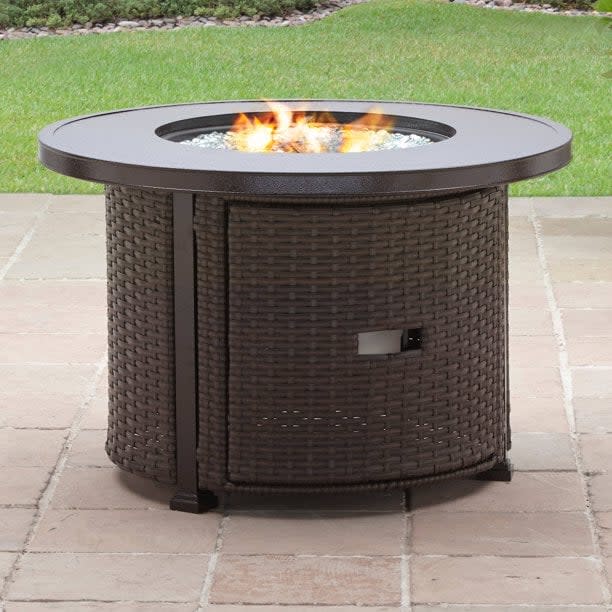 <p>The <span>Better Homes &amp; Gardens 37" Round 50000 BTU Propane Bronze Finish Aluminum Fire Pit</span> ($299, originally $399) is sure to be a hit amongst the whole family.</p>