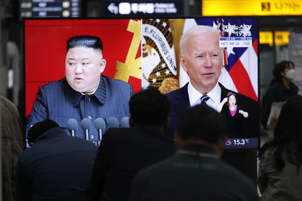 FILE - In this March 26, 2021, file photo, commuters watch a TV showing file imagea of North Korean leader Kim Jong Un and U.S. President Joe Biden during a news program at the Suseo Railway Station in Seoul, South Korea. State media say Kim vowed to launch an “uncompromising struggle” against anti-socialist elements and build a perfect self-supporting economy. Kim's comments released Thursday, May 27, 2021 come as he seeks greater internal strength to overcome pandemic-related difficulties and U.S.-led sanctions. (AP Photo/Ahn Young-joon, File)