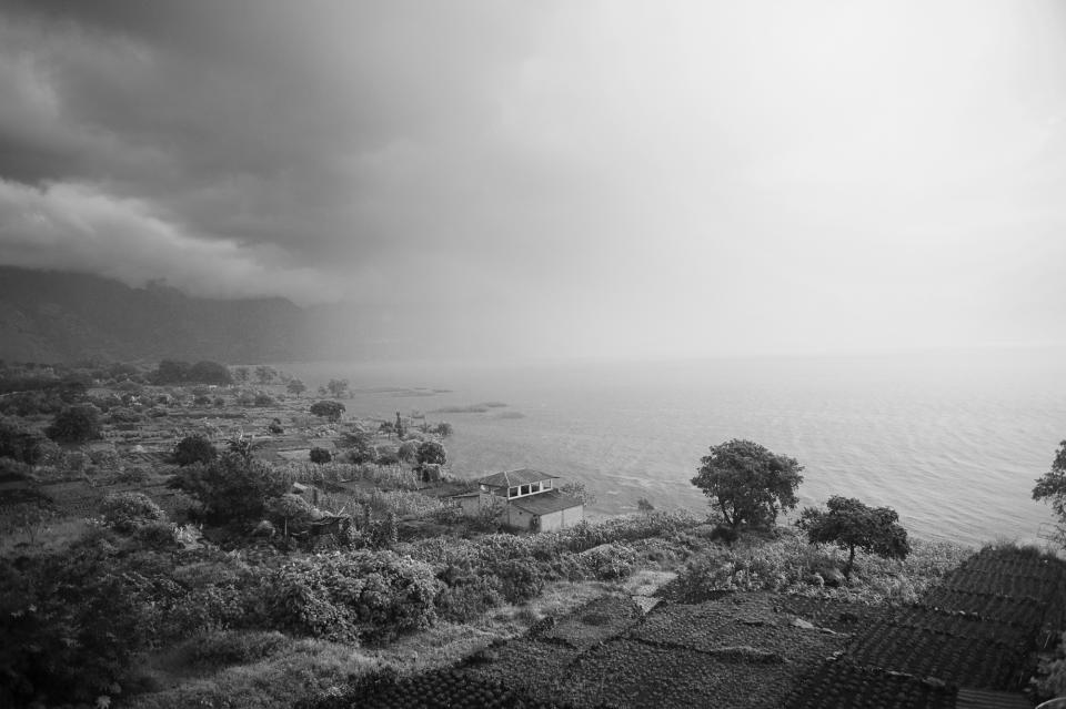 <p>The village of San Pedro la Laguna with Lake Atitlán in the distance, in Guatemala. (Photograph by Fran Antmann) </p>