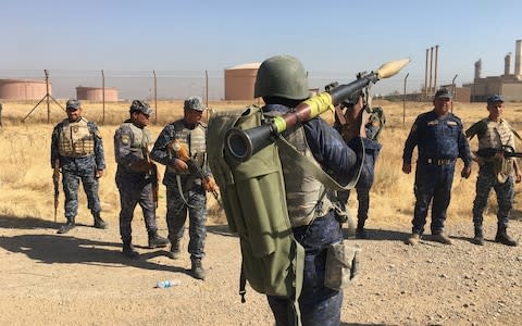 Members of Iraqi federal forces enter oil fields in Kirkuk, Iraq  - Credit: Reuters