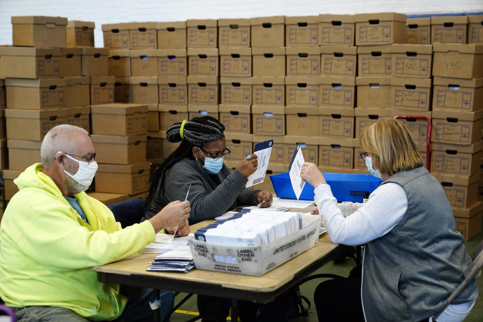 Election workers in Chester County, Pennsylvania, processing mail-in and absentee ballots on Wednesday. President Donald Trump has baselessly claimed that mail-in voting leads to voter fraud and is filing lawsuits meant to stop ballots from being counted. (Photo: AP Photo/Matt Slocum)