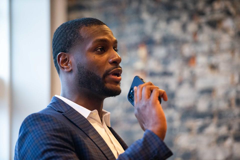 Larry Jackson, a Democratic candidate for Michigan's 86th District, talks to a crowd of supporters during his campaign kickoff Friday, April 22, 2022, at Brew Merchant in Holland.