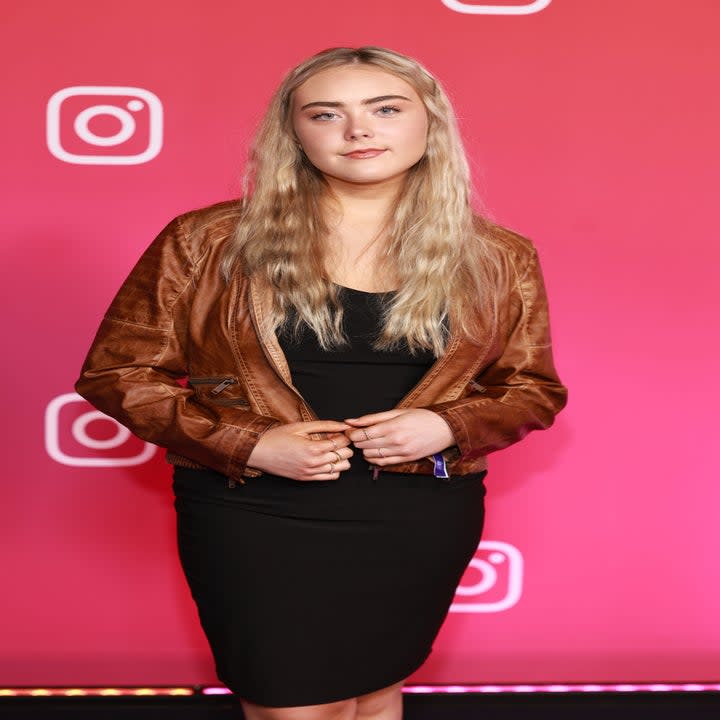 Mila Nabours attends Instagram Night Out at VidCon 2023, photographed on the purple carpet.