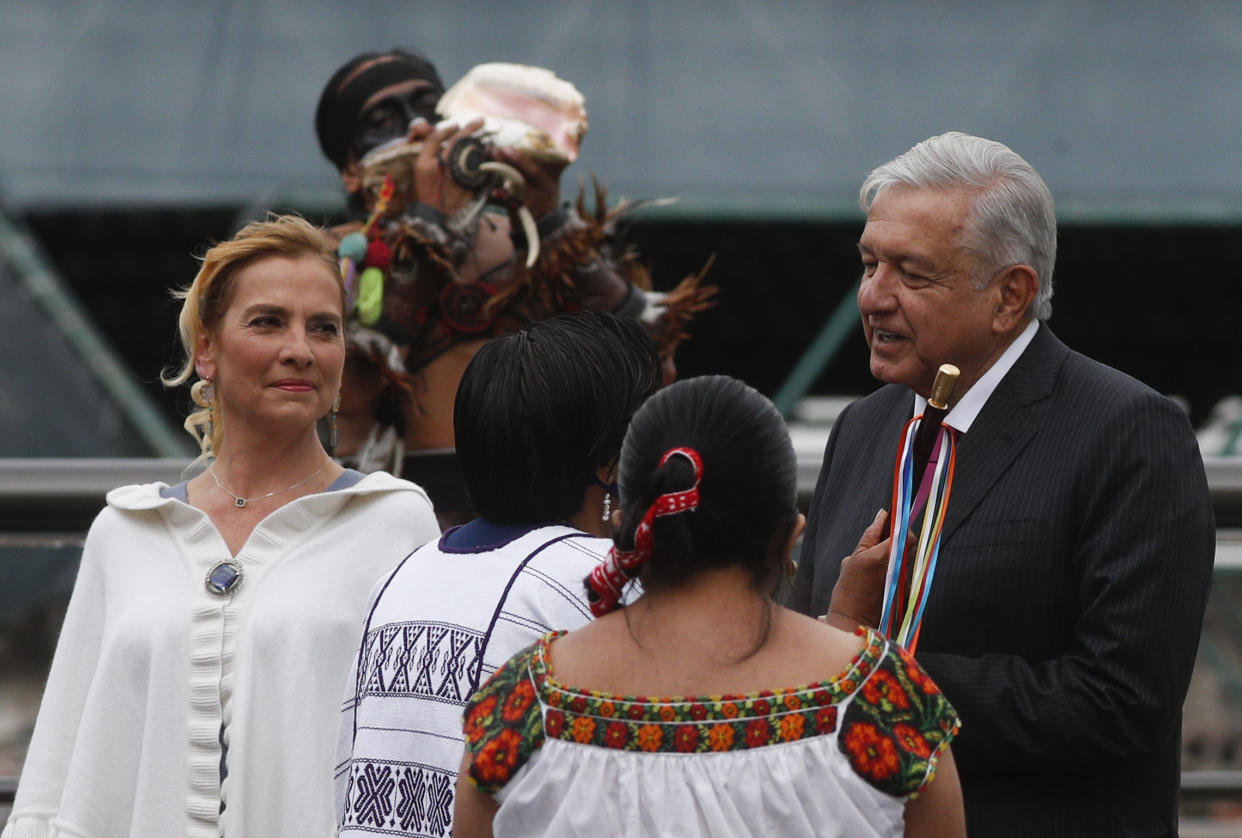 Mexican President Andres Manuel Lopez Obrador and his wife Beatriz Gutierrez Muller attend a ceremony marking the 700 year anniversary of the founding of Tenochtitlan, known as Mexico City, at the Templo Mayor archeological site in Mexico City, Thursday, May 13, 2021. (AP Photo/Eduardo Verdugo)