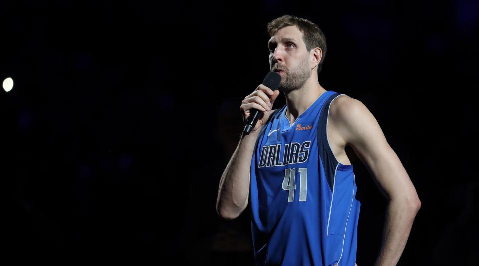 Dirk Nowitzki is introduced to the home crowd in Dallas. (AP)