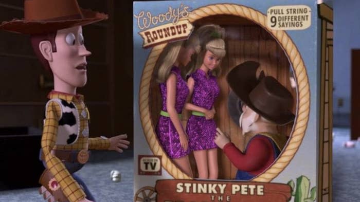 stinky pete in a toy box with two barbies