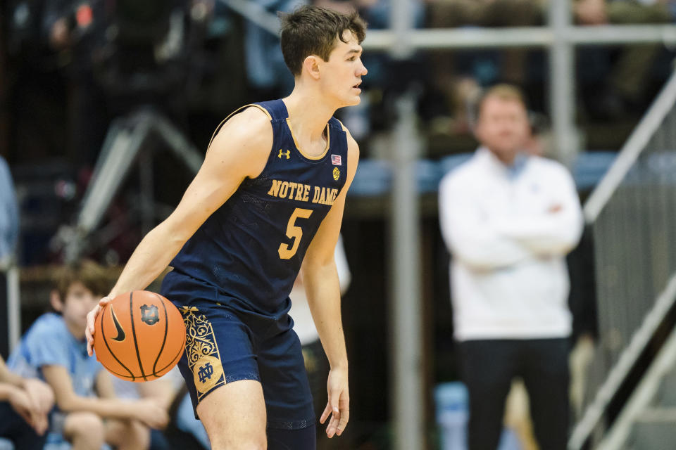 Notre Dame guard Cormac Ryan (5) brings the ball up court in the first half of an NCAA college basketball game against North Carolina on Saturday, Jan. 7, 2023, in Chapel Hill, N.C. (AP Photo/Jacob Kupferman)