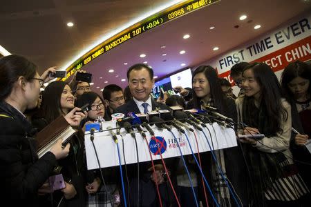 Wang Jianlin, chairman of Wanda commercial properties, speaks to the media during the debut of the company at the Hong Kong Stock Exchange December 23, 2014. REUTERS/Tyrone Siu