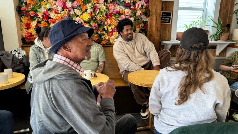 Family and friends gathered to remember three regular customers at Alteregos Cafe.