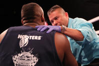 <p>David Chestnut is checked out by a doctor after being down by opponent Thomas Boatswain during the NYPD Boxing Championships at the Theater at Madison Square Garden on June 8, 2017. (Photo: Gordon Donovan/Yahoo News) </p>