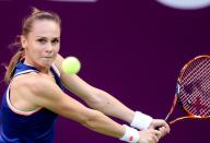 Magdalena Rybarikova of Slovakia returns the ball to Francesca Schiavone of Italy during the second day of the WTA Qatar Ladies Open in Doha, Qatar, Tuesday, Feb. 11, 2014. (AP Photo/Osama Faisal)