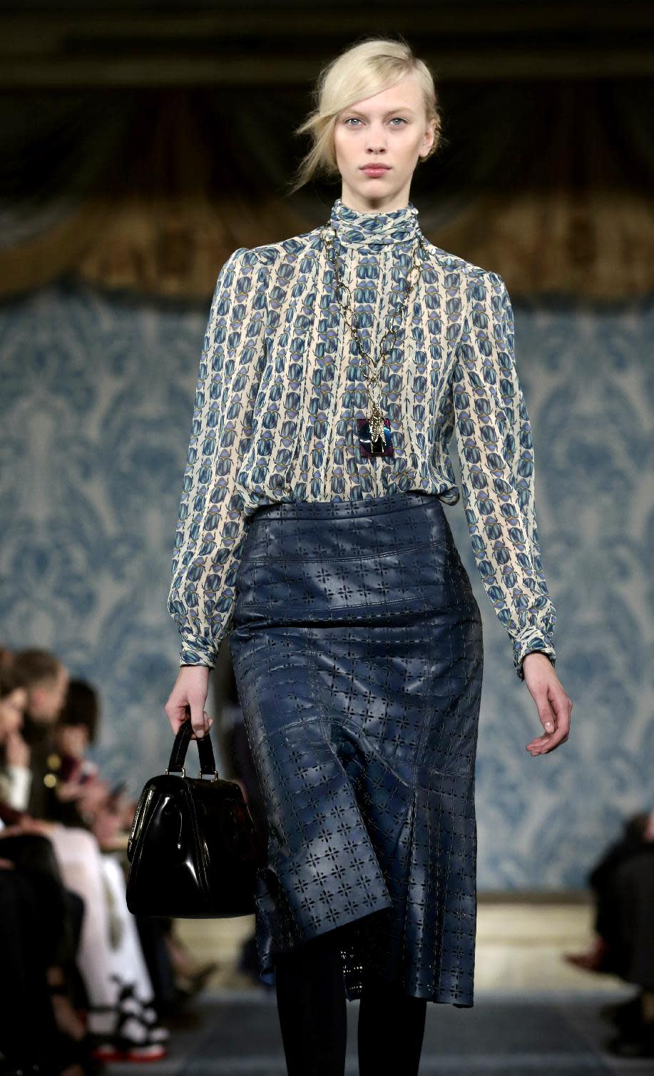 The Tory Burch Fall 2013 collection is modeled during Fashion Week in New York on Tuesday, Feb. 12, 2013. (AP Photo/Richard Drew)