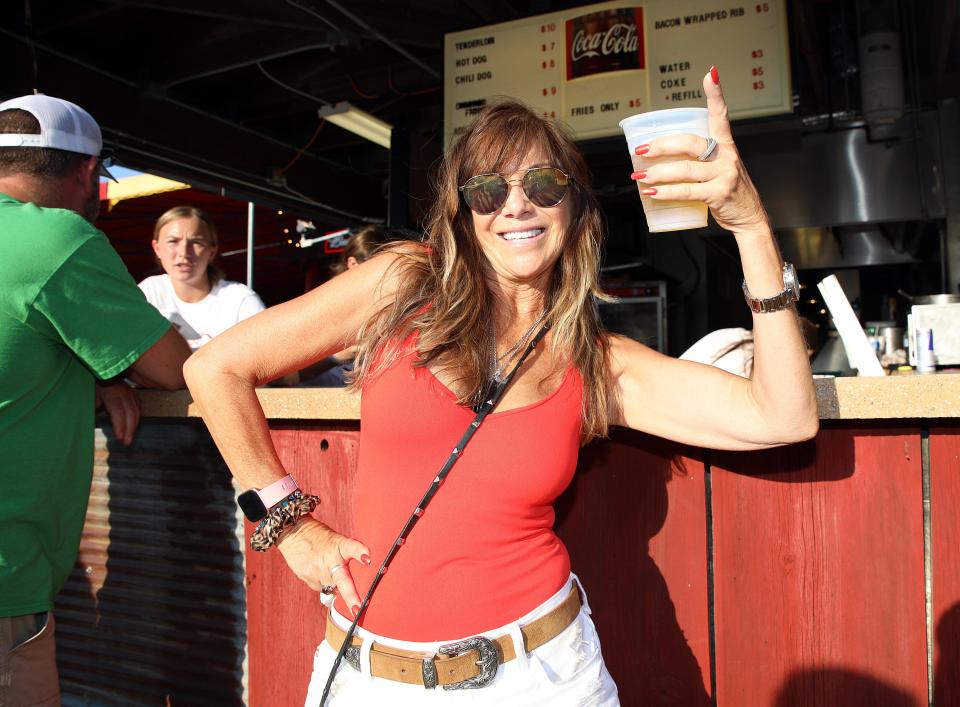 In 2022, Roxie Rayla of Urbandale enjoys the Iowa State Fair’s biggest party, East Side Night, at the Bud Tent on the Iowa State Fairgrounds.