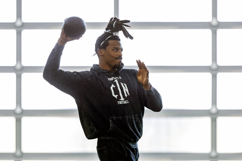 Former NFL and Auburn quarterback, Cam Newton, throws a pass during Auburn Pro Day, Tuesday, March 21, 2023, in Auburn, Ala. (AP Photo/Butch Dill)