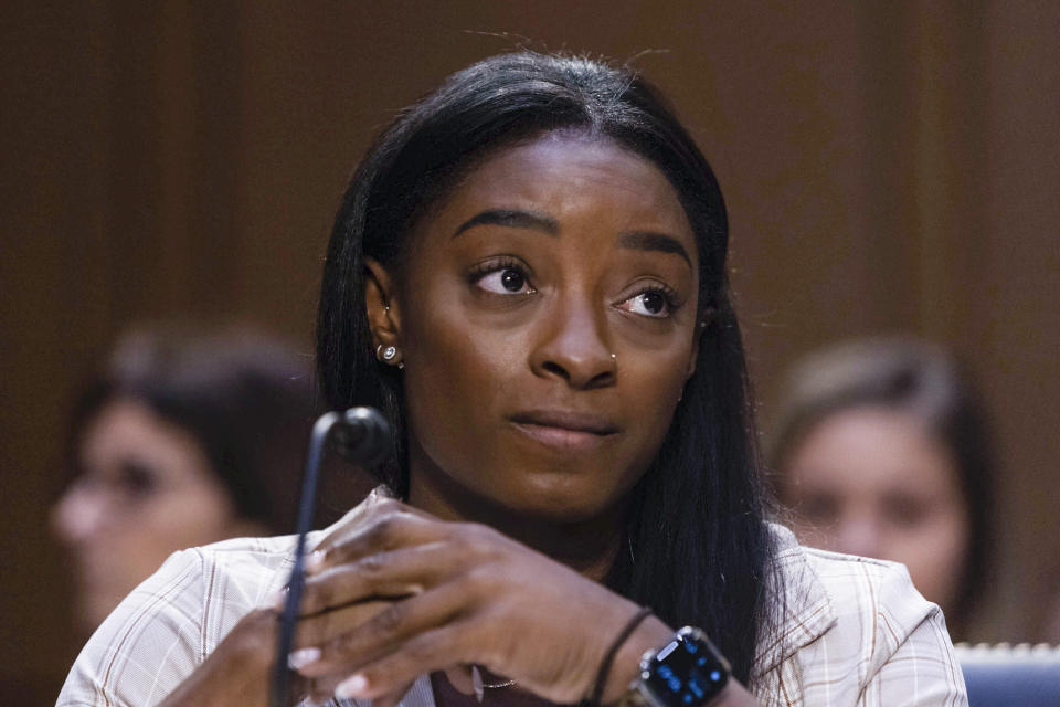 FILE - United States Olympic gymnast Simone Biles testifies during a Senate Judiciary hearing about the Inspector General's report on the FBI's handling of the Larry Nassar investigation on Capitol Hill, Sept. 15, 2021, in Washington. The FBI has reached out to attorneys representing Olympic gold medalist Simone Biles and other women who say they were sexually assaulted by Larry Nassar to begin settlement talks in the $1 billion claim they brought against the federal government, according to three people familiar with the matter. (Graeme Jennings/Pool via AP)