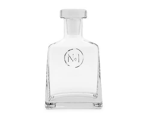 <b>No 1. Decanter</b> <br><br>Designed in-house and exclusive to Indigo, the clear glass No. 1 Decanter will make a handsome addition to the at-home bar. Featuring embossed detailing and a glass lid, it makes a great gift for someone special or your holiday host. Measures 3 x 5 x 8.5-inches. 1 litre / 1000 ml. Suggested retail price $39.50, available in-store at Indigo locations across Canada and online at <a href="http://www.chapters.indigo.ca/home/" rel="nofollow noopener" target="_blank" data-ylk="slk:indigo.ca;elm:context_link;itc:0;sec:content-canvas" class="link ">indigo.ca</a>.