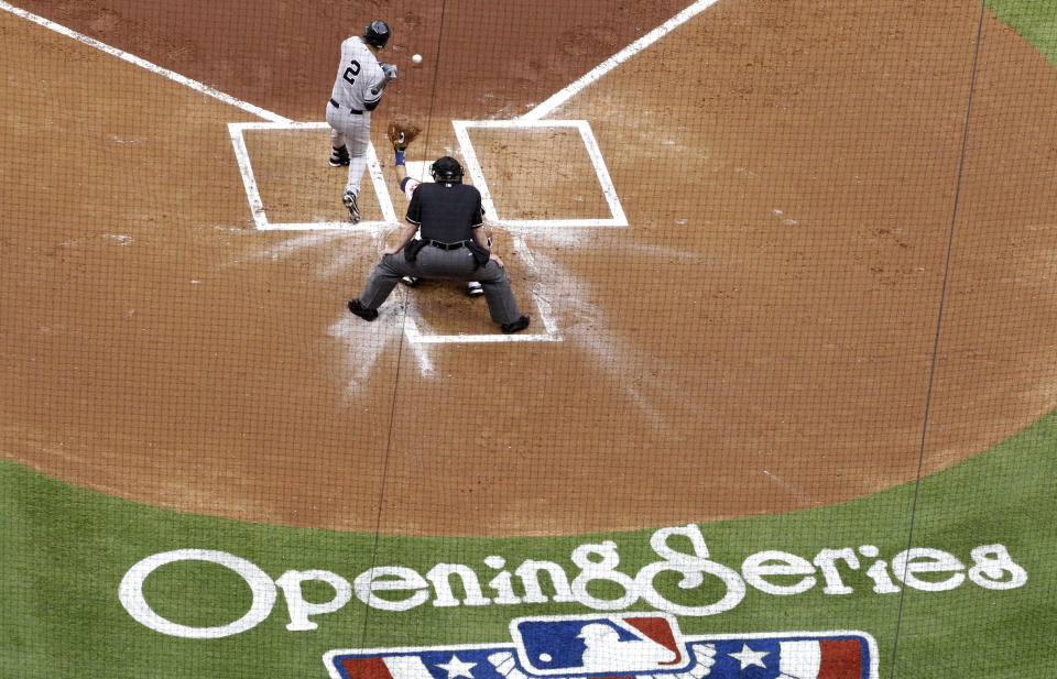 New York Yankees' Derek Jeter is hit by a pitch in the first inning of a baseball game against the Houston Astros, Tuesday, April 1, 2014, in Houston. (AP Photo/Patric Schneider)