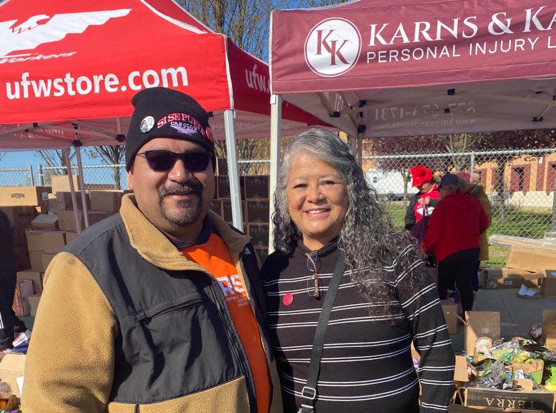 Si Se Puede Car Club founder Andrew Rodriguez Sr with UFW president Teresa Romero.