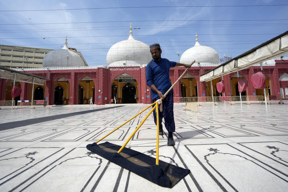 A Pakistani man cleans a mosque in preparation for the upcoming Muslim fasting month of Ramadan, in Karachi, Pakistan, Saturday, March 9, 2024. (AP Photo/Fareed Khan)