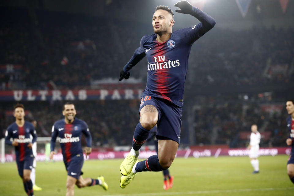 PSG's Neymar celebrates after scoring the opening goal during the League One soccer match between Paris Saint Germain and Guingamp at the Parc des Princes stadium in Paris, Saturday, Jan. 19, 2019. (AP Photo/Michel Euler)