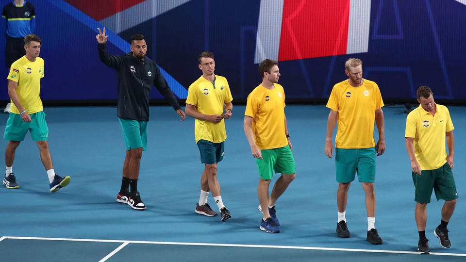 Lleyton Hewitt, pictured here leading his team onto the court prior to their semi-final against Spain.