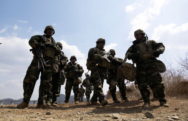 FILE PHOTO: South Korean and US soldiers conduct a joint river-crossing exercise in Yeoncheon