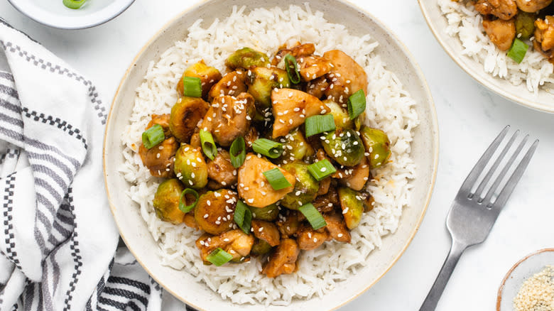 Chicken and Brussels sprouts stir fry in bowl