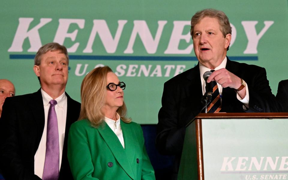 Senator John Kennedy, joined by his wife, Becky, addresses supporters during his election night party - Hilary Scheinuk/The Advocate via AP
