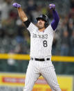 Colorado Rockies' Josh Fuentes celebrates after hitting a two-run against Cincinnati Reds starting pitcher Lucas Sims in the 11th inning of a baseball game Saturday, May 15, 2021, in Denver. (AP Photo/David Zalubowski)