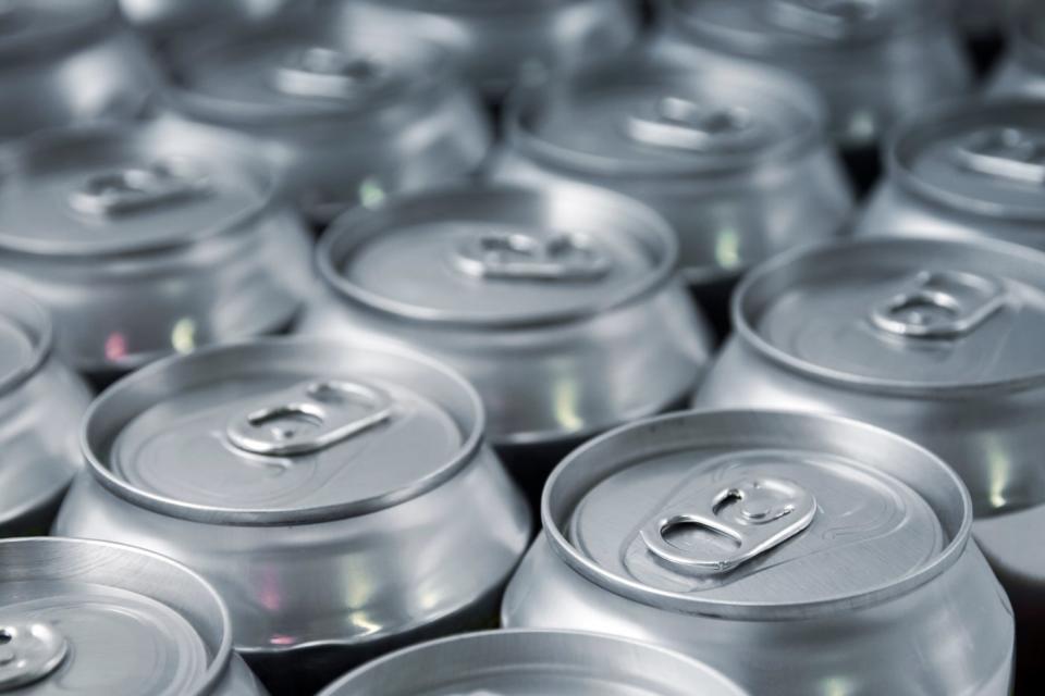 Aluminum beverage cans next to each other.