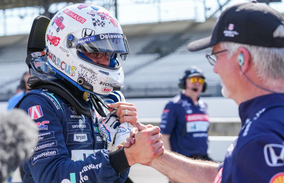 Andretti Global driver Marcus Ericsson (28) shakes hands with a crew member on Sunday, May 19, 2024, during qualifying for the 108th running of the Indianapolis 500 at Indianapolis Motor Speedway.