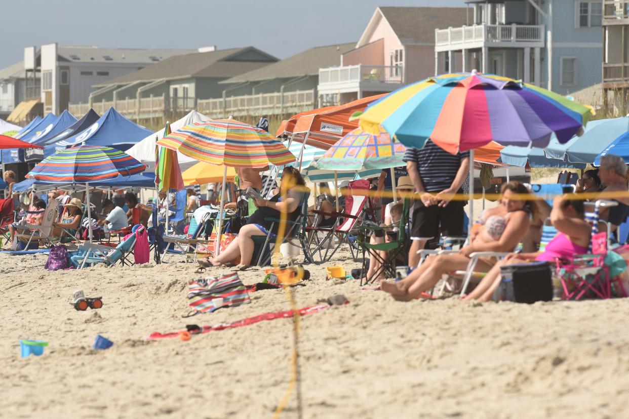 Beachgoers and surfers enjoyed the day along the ocean in Carolina Beach, N.C. Saturday Aug. 25, 2018.