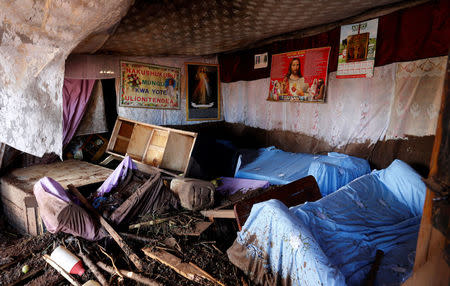 A house partly destroyed by flood waters after a dam burst, is pictured in Solio town near Nakuru, Kenya May 10, 2018. REUTERS/Thomas Mukoya